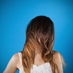 Woman with hair over her face